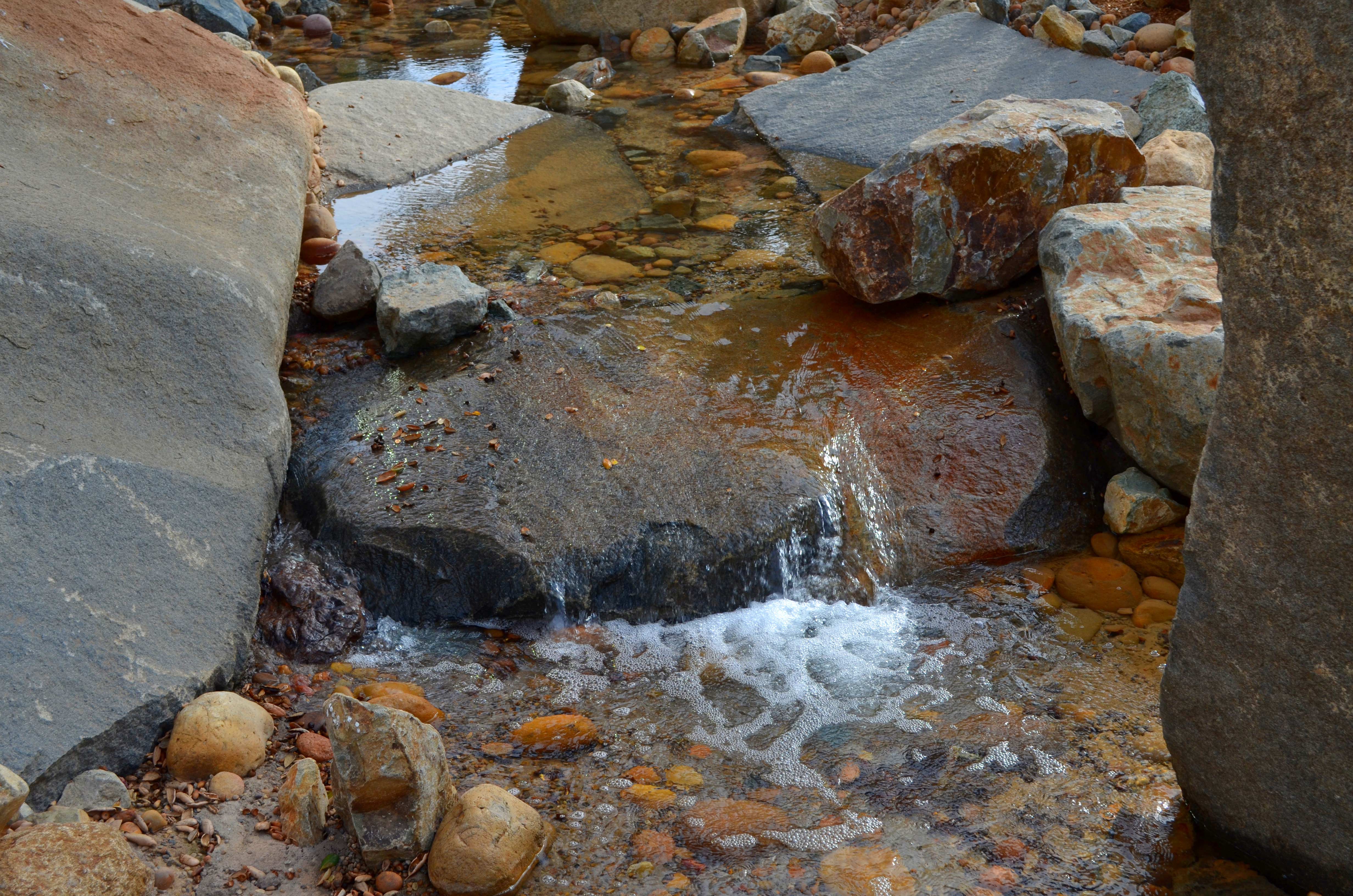 Healthcare facility water feature with stream and rocks